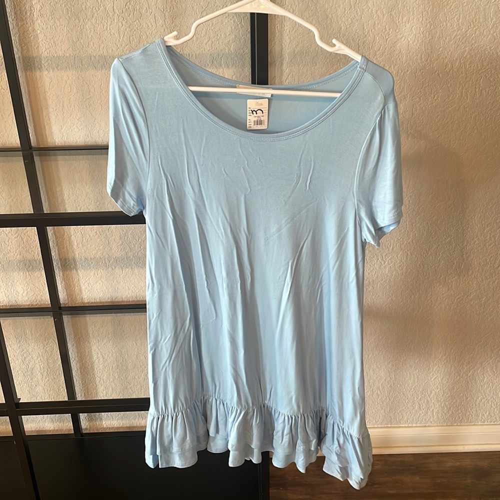 Light Blue T-shirt dress with ruffles at the bottom.
